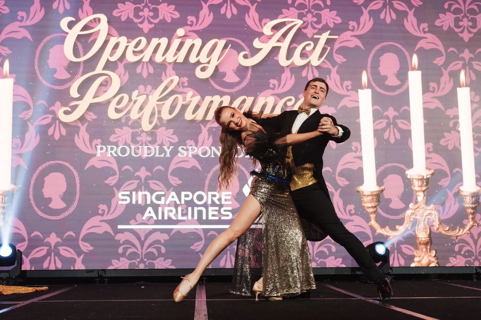Professional ballroom dancers stage performance