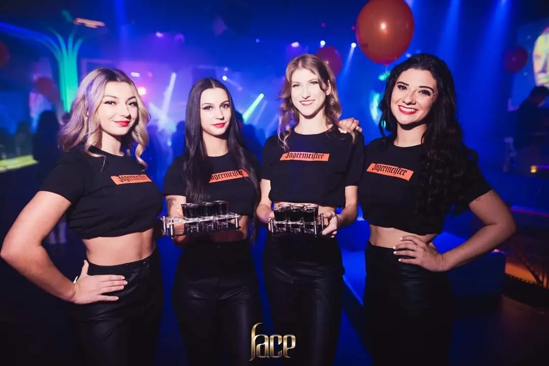Promotional team in branded T-shirts at a nightclub activation